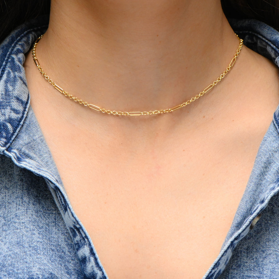 model wearing a dainty gold chain choker neckalce 