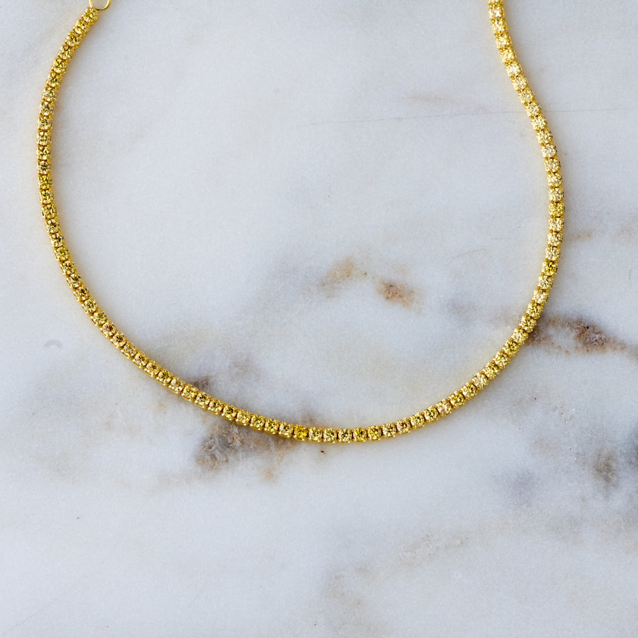 gold anklet with yellow stones