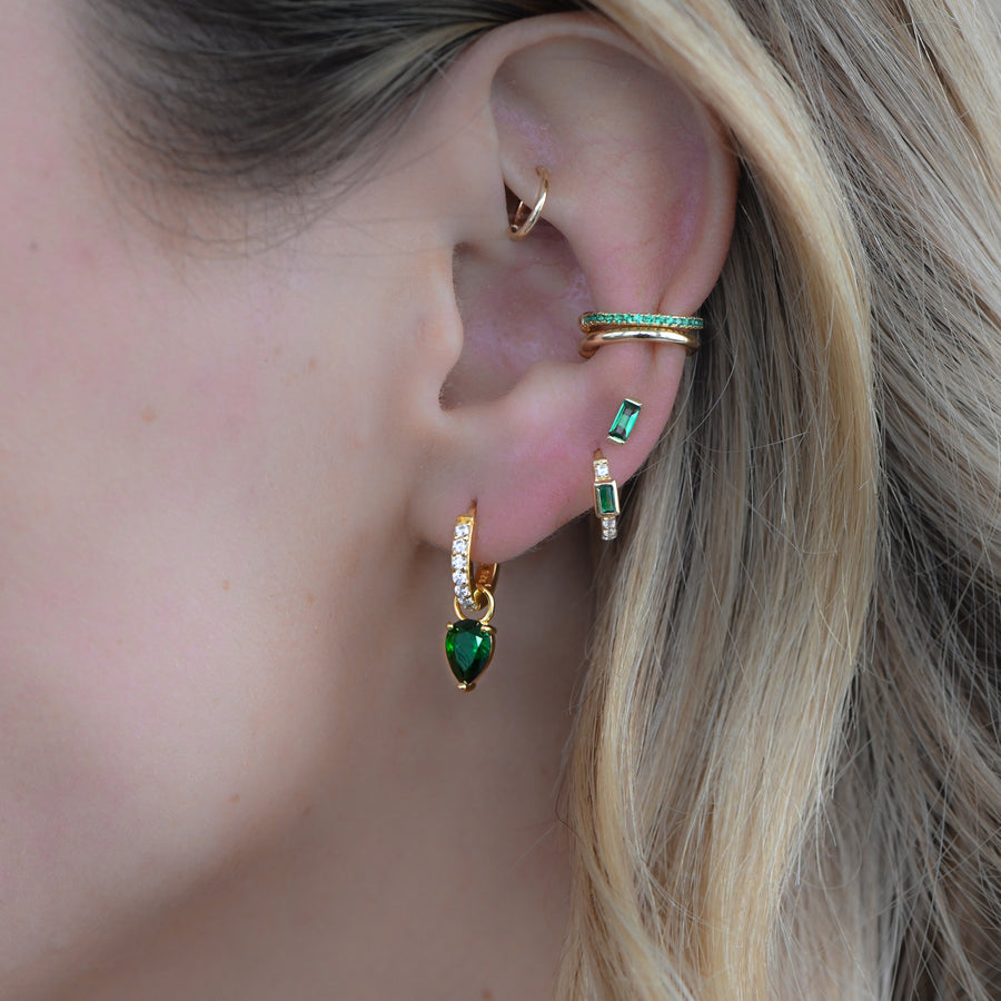 emerald gold tear drop earrings paired with emerald baguette huggies and stud