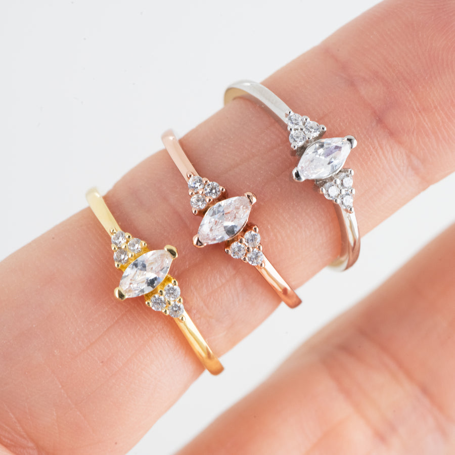 silver, rose gold, and gold marquise ring