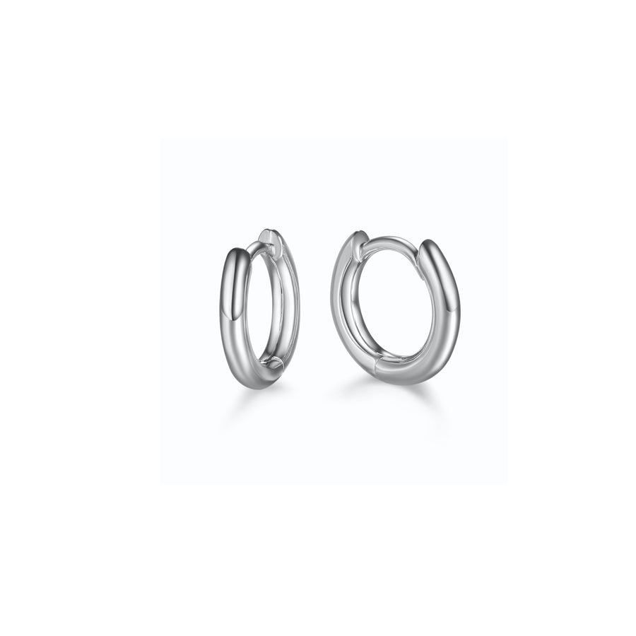 a pair of silver, huggie style hoop earrings