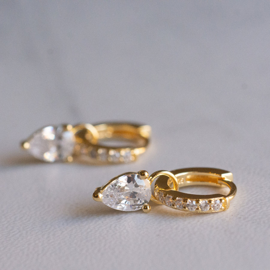 gold tear drop charm huggie earrings