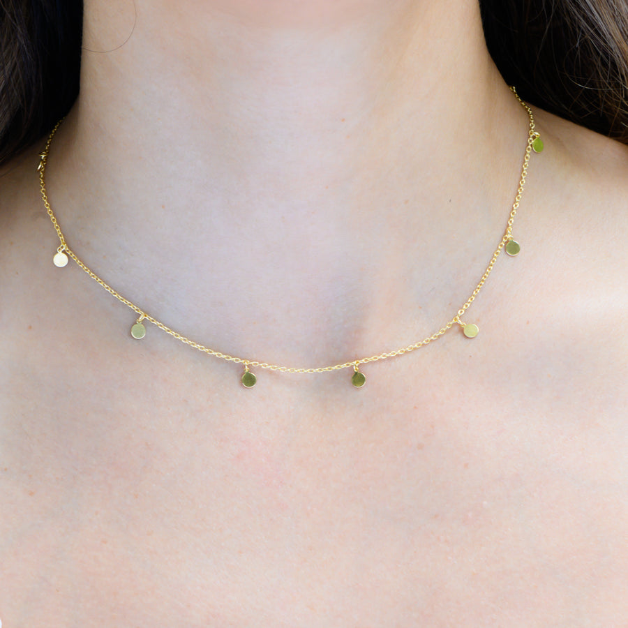 gold necklace with disc charms