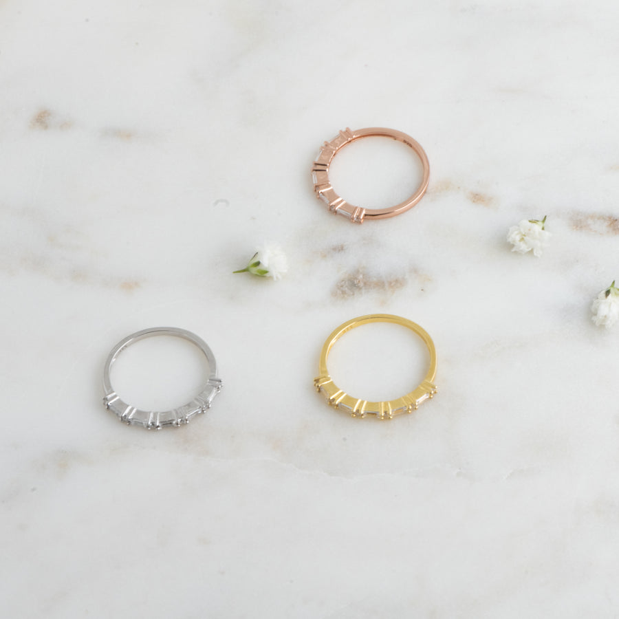 gold, silver, and rose gold baguette ring