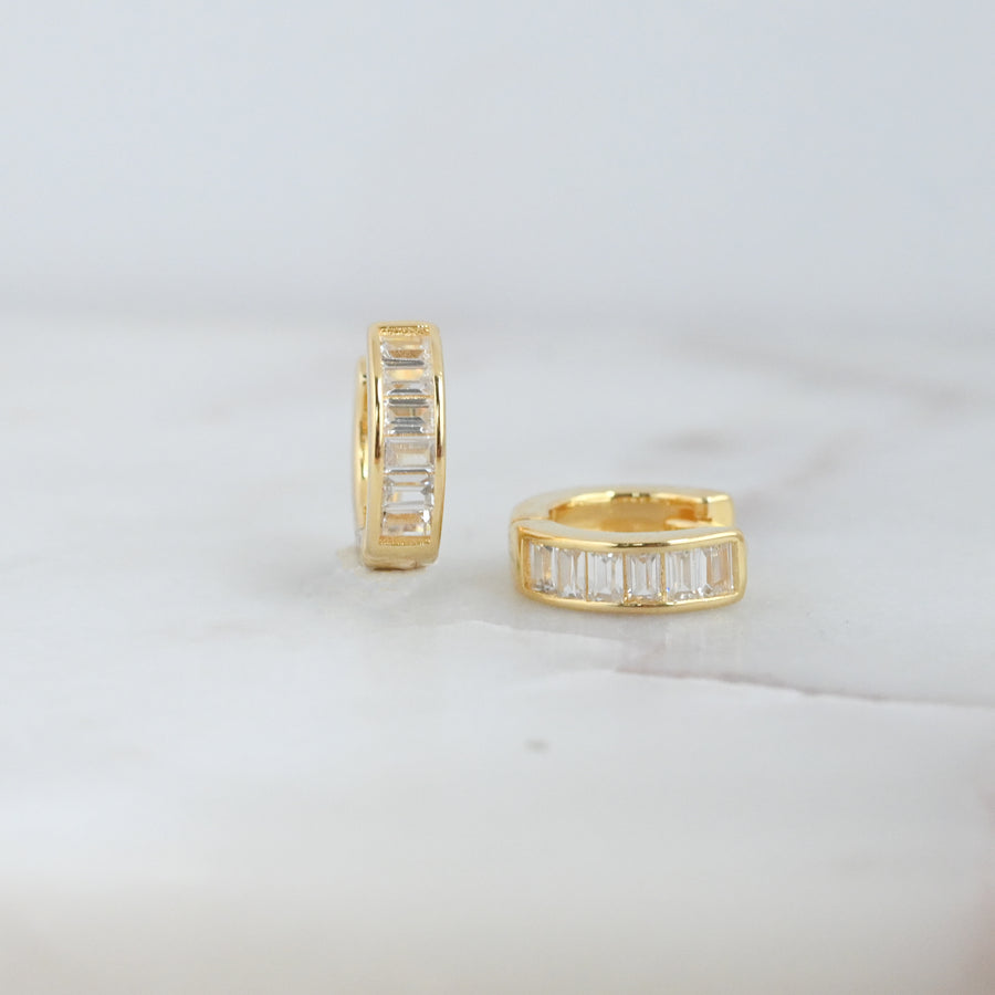 gold pair baguette stone huggie hoop earrings