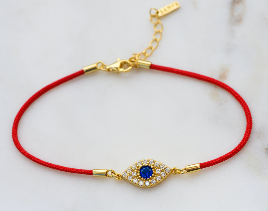 gold red string evil eye bracelet 
