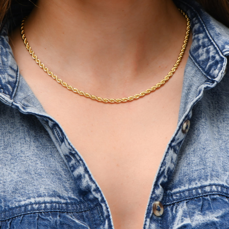 model wearing a gold rope chain necklace