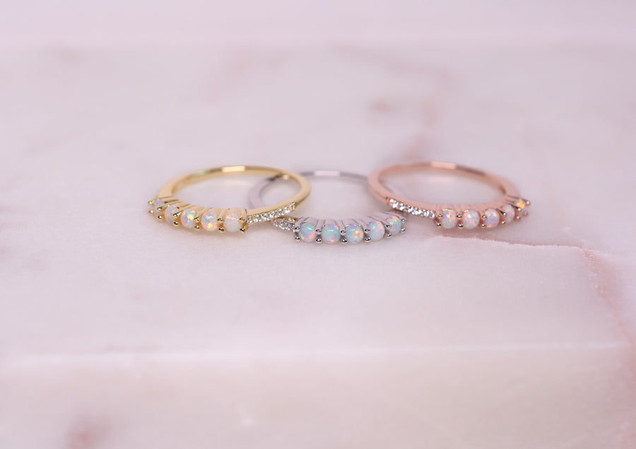 gold, rose gold, and silver opal rings