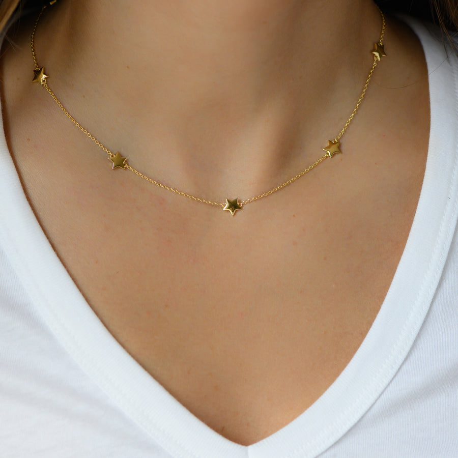 gold star charm necklace