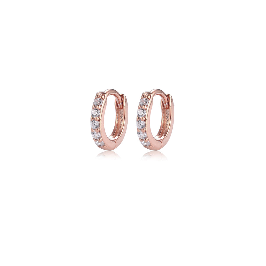 a pair of rose gold pave huggie hoop earrings