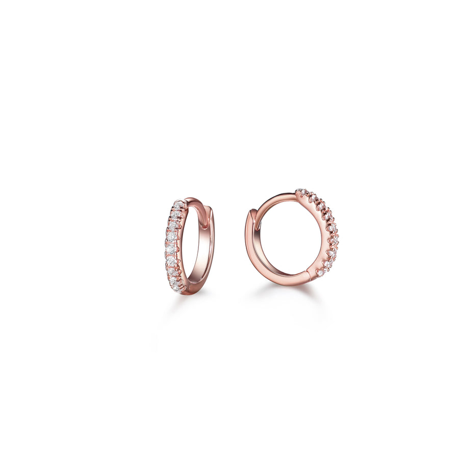 a pair of rose gold small hoop earrings made of pave cubic zirconia stones 