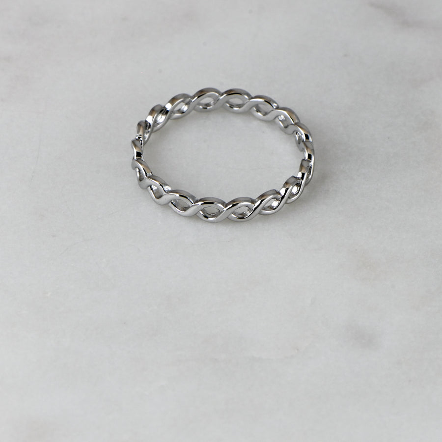 silver eternity band with an eternity pattern throughout 