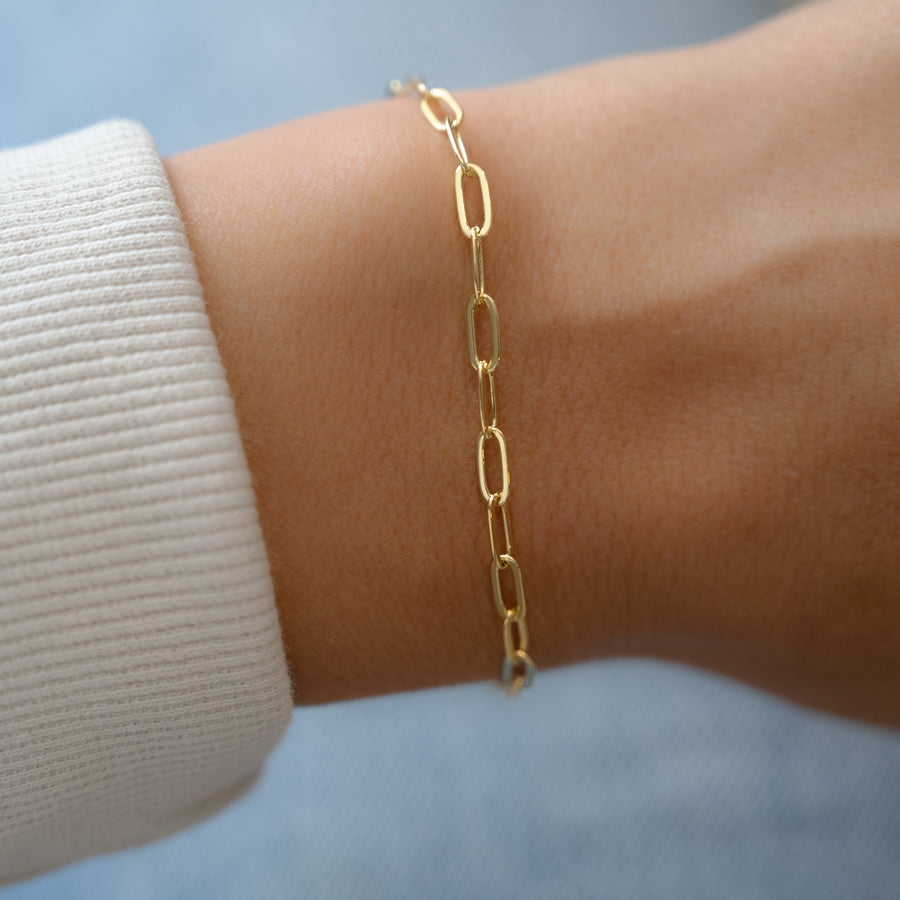 stacking small gold paperclip bracelet
